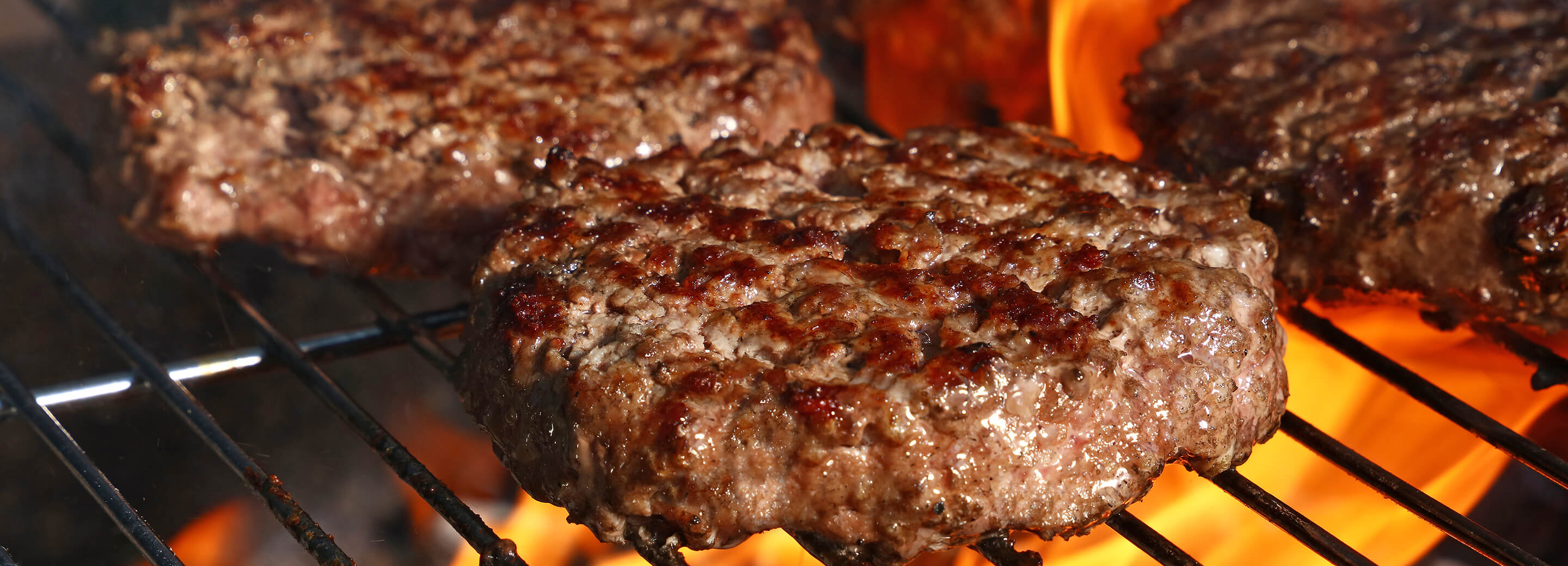 burger patties on the grill